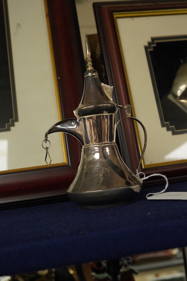 A glass framed white metal khanjar and a similar dhow, together with part model of a Dallah, 16.3cm.